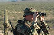 Eyes on the Border - A National Guard member, of Jacksonville, Fla., scans out over the Arizona desert on Monday, Nov. 14, 2006. Verne is one of over 1800 Guardsmen from around the nation currently working to protect Arizona's border with Mexico. Fifteen Arkansas Air National Guardsmen are there supporting Operation Jump Start as well. The majority of the Arkansas troops are conducting support operations which effectively frees up Border Patrol agents to get out on the line and apprehend those crossing the border illegally. (Photo by Capt. Chris Heathscott, Arkansas National Guard State Public Affairs Office)