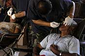 A Nicaraguan man has a tooth pulled by U.S. Air Force Maj. Steve Shin, from the 144th Medical Group, California Air National Guard, at a school in San Gregorio, Nicaragua, March 19, 2007, during a medical readiness training exercise in support of New Hor izons-Nicaragua 2007. (U.S. Air Force photo by Staff Sgt. Jason T. Bailey)