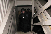A member of the Old Colony Regional Special Operations Group climbs a stairway during a team movement exercise at the Maj. Jeffery R. Calero Military Operations in Urban Terrain training site on Camp Edwards, Mass., Jan. 29, 2009. The group, made up of law enforcement officers from eight agencies, changed scenarios several times to prepare officers for unknown situations. (U.S. Army photo by Sgt. James C. Lally)