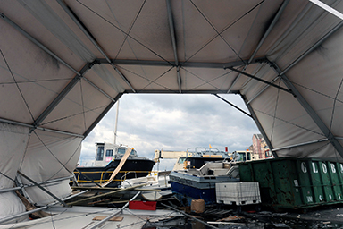 Guard members from Maine responded last Friday to help those affected by Hurricane Sandy's devastation. Here, civilian watercraft land in a pile alongside Army watercraft and equipment at Caven Point Marine Terminal of the U.S. Army Corps of Engineers, Nov. 2, 2012.