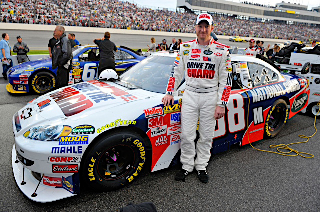 Earnhardt poses with the No.88 Drive The Guard/AMP Energy car before the race at Richmond International Raceway. Earnhardt finished 27th after flirting with a top-10 slot. 