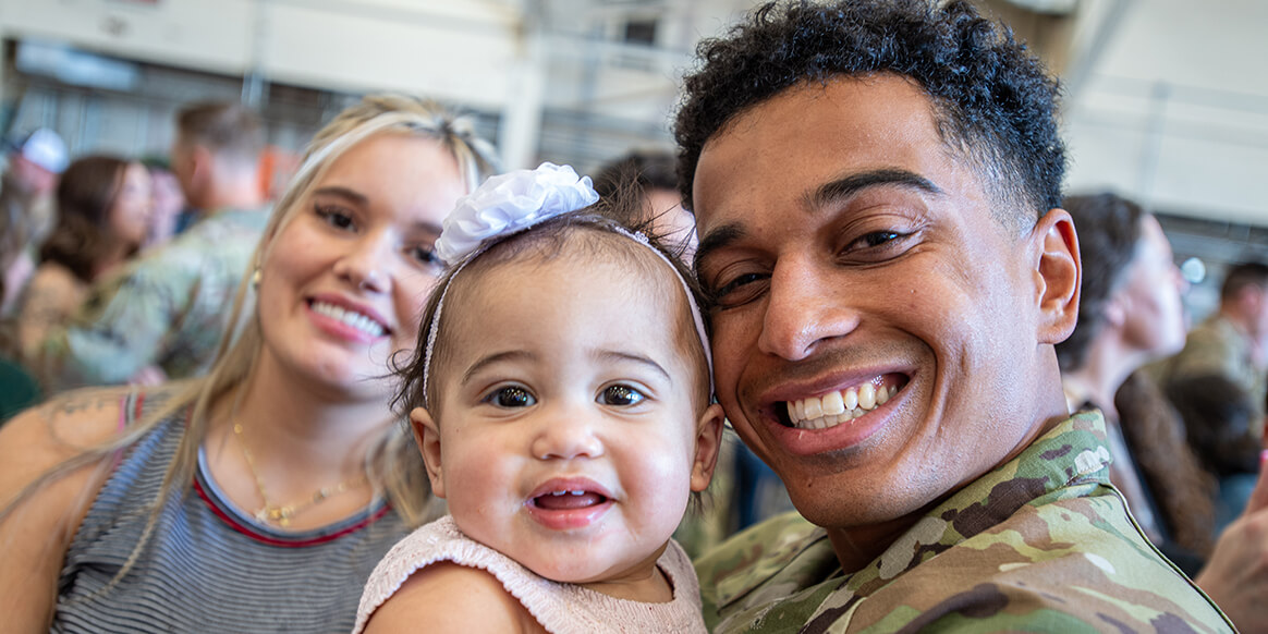 A member of Task Force Tomahawk reunites with their family during a welcome home ceremony at Will Rogers Air National Guard Base in Oklahoma City.