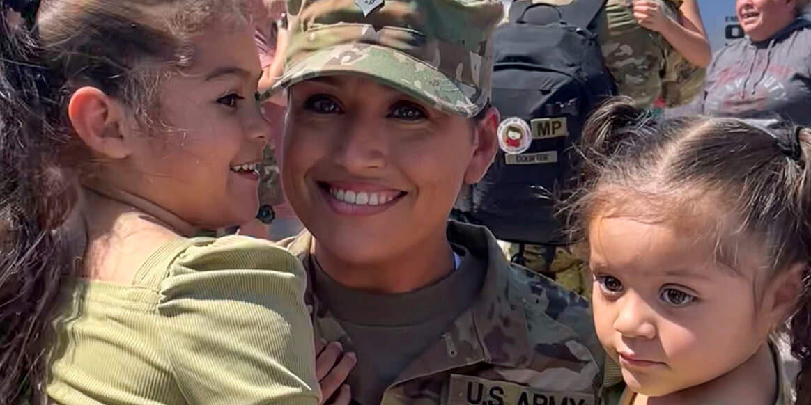 Families, friends and colleagues welcomed home 50 Soldiers with the 1057th Military Police Company from their nearly 10-month overseas deployment to the Middle East during a brief ceremony at the Weborg 21 Centre in Gering, Nebraska, Aug. 22, 2022.
