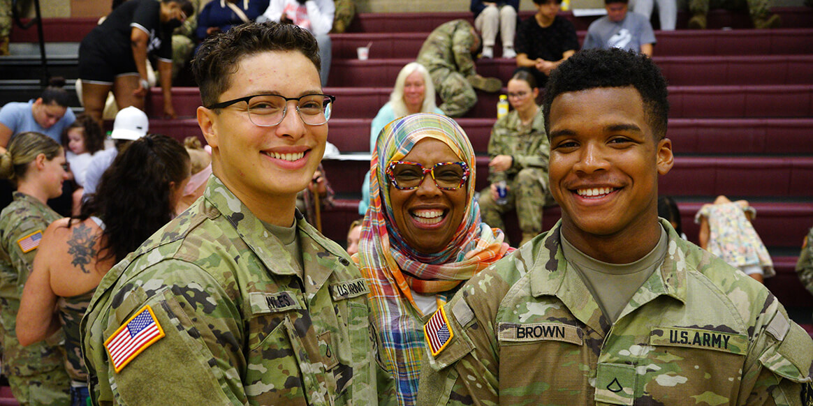 Soldiers assigned to the 252nd Quartermaster Company, 213th Regional Support Group, Pa. National Guard, pose together with a supportive family member during their deployment ceremony at the Southampton Roads Armory in Philadelphia, June 3.