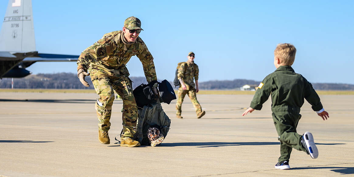 Airmen from the 139th Airlift Wing, Missouri Air National Guard, are greeted by family members at Rosecrans Air National Guard Base, St. Joseph, Missouri, Nov. 19, 2020.