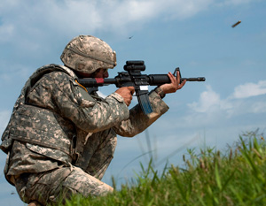 Spc. Robert Cunningham, with the West Virginia Army National Guard's 119th Engineer Company (Sapper) engages targets during the 2014 Army National Guard Best Warrior Competition at Camp Joseph T. Robinson, Arkansas, July 14, 2014. Cunningham is one of 14 competitors in the competition--which tests competitors on a variety of tactical and technical skills in a physically and mentally demanding environment--vying to earn the title of Best Warrior and become the Soldier and Noncommissioned Officer of the Year for the Army Guard. The winners of the competition will go on to represent the Army Guard in the Department of the Army level Best Warrior Competition later this year. (U.S. Army photo by Staff Sgt. Darron Salzer)