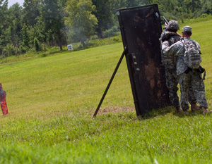 Sgt. 1st Class Scott Stimpson, a recruiter with the Oregon Army National Guard engages targets during the 2014 Army National Guard Best Warrior Competition at Camp Joseph T. Robinson, Arkansas, July 14, 2014. Stimpson is one of 14 competitors in the competition--which tests competitors on a variety of tactical and technical skills in a physically and mentally demanding environment--vying to earn the title of Best Warrior and become the Soldier and Noncommissioned Officer of the Year for the Army Guard. The winners of the competition will go on to represent the Army Guard in the Department of the Army level Best Warrior Competition later this year. (U.S. Army photo by Staff Sgt. Darron Salzer)