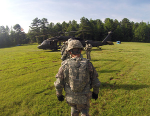 Competitors mounting the UH-60 Blackhawk