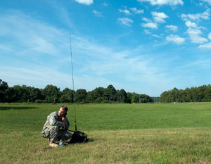 A competitor in the 2014 Army National Guard Best Warrior Competition uses a radio during the competition at Camp Joseph T. Robinson, Arkansas, July 14, 2014. The competition tests competitors on a variety of tactical and technical skills in a physically and mentally demanding environment as they vie to earn the title of Best Warrior and become the Soldier and Noncommissioned Officer of the Year for the Army Guard. The winners of the competition will go on to represent the Army Guard in the Department of the Army level Best Warrior Competition later this year. (U.S. Army photo by Staff Sgt. Darron Salzer)