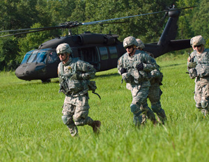 Competitors in the 2014 Army National Guard Best Warrior Competition move out to their next event during the competition at Camp Joseph T. Robinson, Arkansas, July 14, 2014. The competition tests competitors on a variety of tactical and technical skills in a physically and mentally demanding environment as they vie to earn the title of Best Warrior and become the Soldier and Noncommissioned Officer of the Year for the Army Guard. The winners of the competition will go on to represent the Army Guard in the Department of the Army level Best Warrior Competition later this year. (U.S. Army photo by Staff Sgt. Darron Salzer)