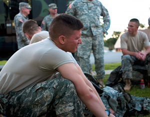 Spc. David Notti, an infantryman with the Montana Army National Guard's B Company, 1st Combined Arms Battalion, 163rd Infantry Regiment, rests after completing the ruck march portion of the 2014 Army National Guard Best Warrior Competition at Camp Joseph T. Robinson, Arkansas, July 16, 2014. The competition tests competitors on a variety of tactical and technical skills in a physically and mentally demanding environment as they vie to earn the title of Best Warrior and become the Soldier and Noncommissioned Officer of the Year for the Army Guard. The winners of the competition will go on to represent the Army Guard in the Department of the Army level Best Warrior Competition later this year. (U.S. Army photo by Staff Sgt. Darron Salzer)