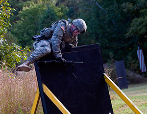 Spc. Ryan Montgomery, an infantryman with the Arkansas National Guard’s 39th Infantry Brigade Combat Team, prepares to scale a short wall at a warrior task and battle drill event as part of the 2014 Department of the Army Best Warrior Competition, Oct. 7, 2014 at Fort Lee, Va. Montgomery represented the Army National Guard as its top enlisted Soldier of the year. (Army National Guard photo by Staff Sgt. Darron Salzer, National Guard Bureau)(Released)
