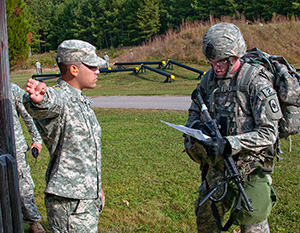 Spc. Ryan Montgomery, an infantryman with the Arkansas National Guard’s 39th Infantry Brigade Combat Team, reads over his mission brief for the next warrior task and battle drill lane at the 2014 Department of the Army Best Warrior Competition, Oct. 7, 2014 at Fort Lee, Va. Montgomery represented the Army National Guard as its top enlisted Soldier of the year. (Army National Guard photo by Staff Sgt. Darron Salzer, National Guard Bureau)(Released)