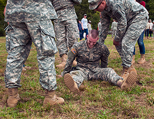 Spc. Ryan Montgomery, an infantryman with the Arkansas National Guard’s 39th Infantry Brigade Combat Team, suffers a severe leg cramp at the 2014 Department of the Army Best Warrior Competition, Oct. 7, 2014 at Fort Lee, Va. Montgomery represented the Army National Guard as its top enlisted Soldier of the year. (Army National Guard photo by Staff Sgt. Darron Salzer, National Guard Bureau)(Released)