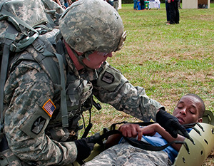 Army Staff Sgt. Devin Jameson Sr., a combat medic with the Utah Army National Guard's 2nd Battalion, 640th Regiment (Regional Training Institute), evaluates a casualty during the warrior task and battle drill event at the 2014 Department of the Army Best Warrior Competition, Oct. 7, 2014 at Fort Lee, Va. Jameson represented the Army National Guard as its top noncommissioned officer of the year. (Army National Guard photo by Staff Sgt. Darron Salzer, National Guard Bureau)(Released)