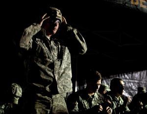 Army Staff Sgt. Devin Jameson Sr., a combat medic with the Utah Army National Guard's 2nd Battalion, 640th Regiment (Regional Training Institute), puts on his protective equipment before the first mystery event at the 2014 Department of the Army Best Warrior Competition, Oct. 9, 2014 at Fort Lee, Va. Jameson represented the Army National Guard as its top noncommissioned officer of the year. (Army National Guard photo by Staff Sgt. Darron Salzer, National Guard Bureau)(Released)