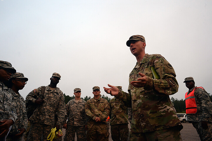 Army Capt. Derek Ellison gives a pep talk to Soldiers in the unit while taking part in the convoy.