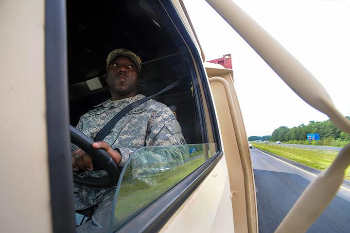 Davis checks his mirrors while driving through North Carolina on Interstate 95.