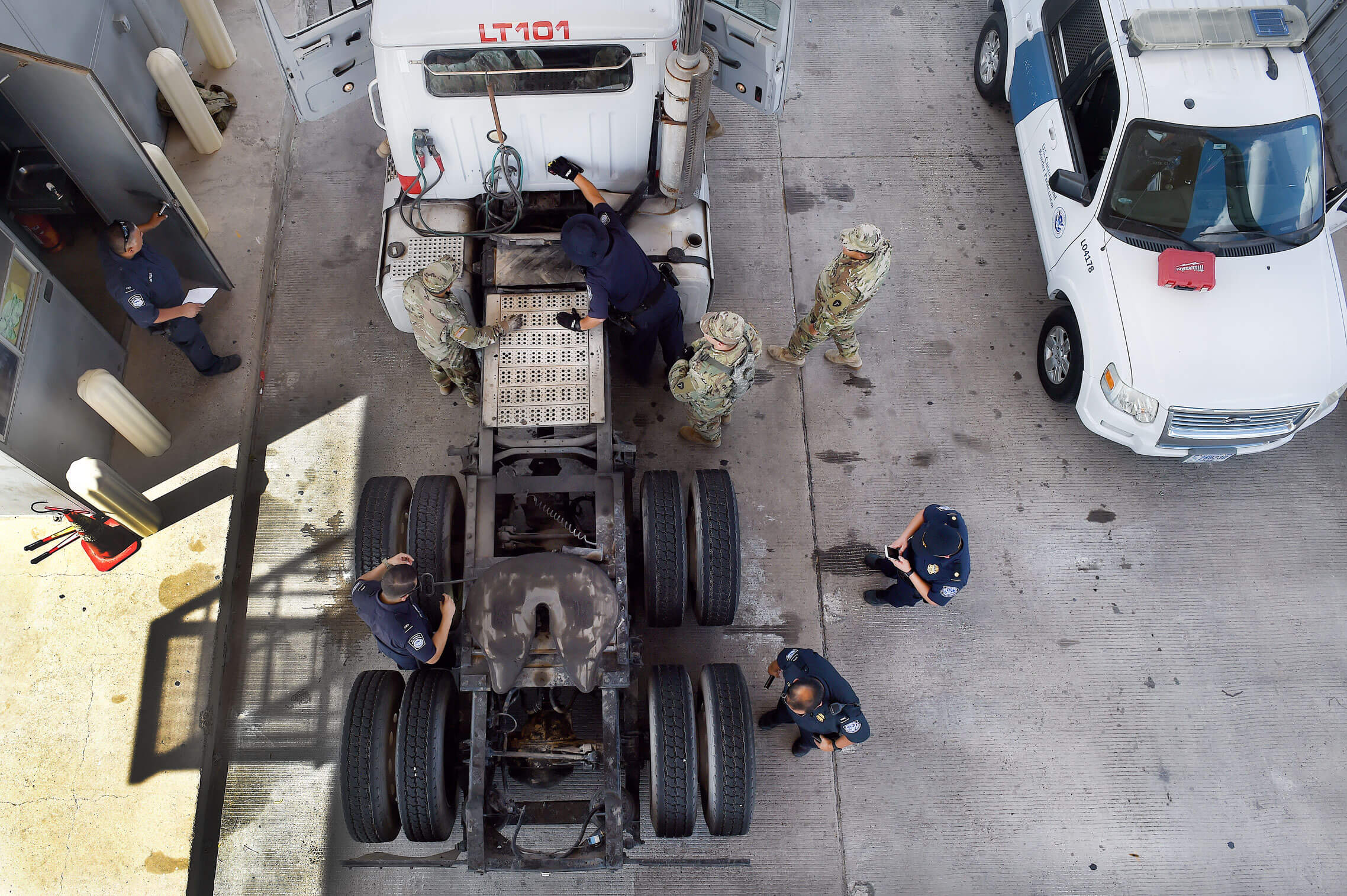 At the U.S. Customs and Border Protection's Pharr, Texas, port of entry no part of the truck is overlooked as Soldiers with the Texas Army National Guard's Company A, 536th Brigade Support Battalion, and CBP officers inspect commercial vehicles transiting from Mexico into the U.S. Approximately 2,000 trucks pass through Pharr each day. Guard members' efforts have allowed increased capability with inspecting inbound trucks for illegal drugs and other prohibited items. In one incident at Pharr, Guard members found close to 100 pounds of heroin and methamphetamine in one vehicle, one of the largest finds since coming on duty in April.