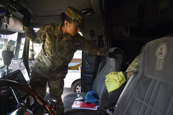 A truck's interior gets an intensive once over as Army Pfc. Amber Popp, a patient administrative specialist with F Company, 536th BSB, looks for anything out of place that may signal the driver is attempting to carry illegal drugs or other prohibited items into the U.S. through the Pharr port of entry. CBP officers immediately take over if illegal items are discovered, seizing them and detaining the driver.