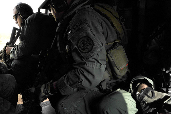 After landing in a remote location near the Arizona - Mexico border, a Border Patrol team exits the UH-60 Black Hawk helicopter piloted by Escobedo. Called in to assist agents on the ground with a group alleged to have crossed the border illegally, landings like this help prepare Escobedo and other pilots for overseas deployments where landing zones may be in rough conditions and not always identified in advance.