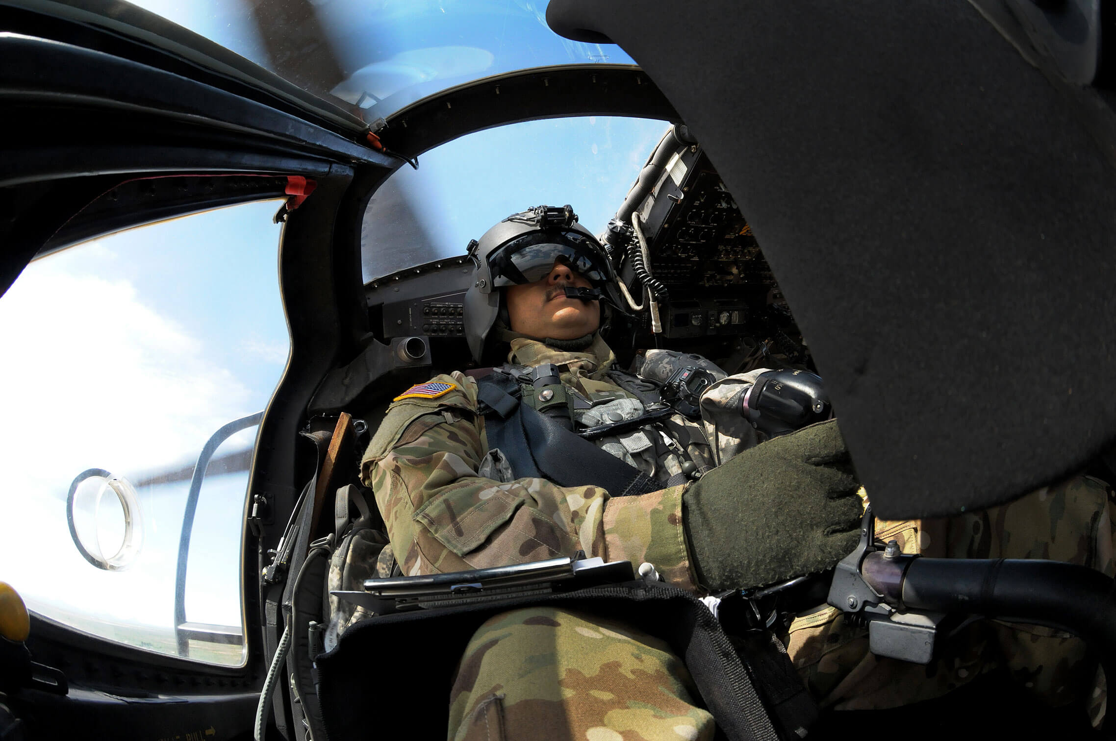 With his eyes on the horizon, Army 1st Lt. Eric Escobedo, a pilot with the Arizona Army National Guard's B Company, 2nd Battalion, 285th Aviation Regiment, pilots a UH-60 Black Hawk helicopter in an area along the Arizona-Mexico border as part of Operation Guardian Support, which provides National Guard assistance to U.S. Border Patrol and U.S. Customs and Border Protection along the Southwest border. For Escobedo, and other members of his unit, that support includes transporting Border Patrol agents to remote locations in the field as well as providing overhead security and surveillance.