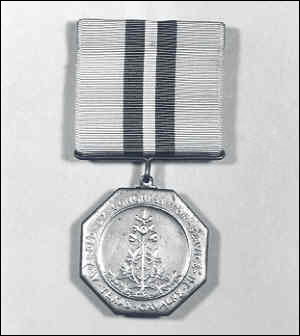 Texas National Guard Cavalry Medal. Around its outer edge reads 'Awarded By Congress For Service-Texas Cavalry' The drape (ribbon) is yellow, green and has a white center stripe). Made by the U.S. mint only about 1,000 were actually issued.