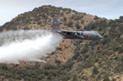 Air National Guard and Air Force Reserve units converged on Tucson, Ariz., in May to take part in Modular Airborne Firefighting System (MAFFS) certification and training 2009. MAFFS is an important and effective tool used to fight wildfires nationwide and is placed onboard the C-130 Hercules aircraft. Four units across the country continue the MAFFS legacy which began in the early 1970s; the 153rd Airlift Wing of the Wyoming Air National Guard, the 145th Airlift Wing of the North Carolina Air National Guard, the 146th Airlift Wing of the California Air National Guard, and the 302nd Airlift Wing, and Air Force Reserve unit based at Peterson Air Force Base, Colo. (Photo by Tech. Sgt. Alex Koenig, California National Guard) 