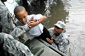 Army Sgt. Lee Savoy, assigned to the Louisiana Army National Guard's 256th Brigade Special Troops Battalion, assists a child Aug. 30, 2012, onto one of the unit's trucks as Soldiers rescue residents from flood waters caused by Hurricane Isaac. The Louisiana National Guard has more than 8,000 Soldiers and Airmen ready to support local and state authorities in support of Hurricane Isaac relief operations. (U.S. Army National Guard photo by Sgt. Rashawn D. Price) 