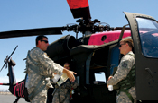 Chief Warrant Officer 5 Jeff Apke, a UH-60 Blackhawk pilot, conducts pre-flight briefing wiht Chief Warrant Officer 2 Joel Newburn, also a Blackhawk pilot, before departing the Mather Flight Facility in northern California July 29 for home. Apke and his fellow crewmembers supported California's firefighting operations since July 14 dropping more than 30,000 gallons of water on the fires. (Photo by Capt. Al Bosco)