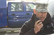  Sgt. Bill Gent, Information Systems NCO for the 102nd Civil Support Team, communicates with Survey Team Members during a CST demonstration event at the Marion County Regional Fire Training Facility in Brooks, Ore., on Oct. 27, 2006.