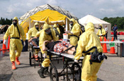 Soldiers assigned to a Chemical, Biological, Radiological, Nuclear Explosive Enhanced Response Force Package search for survivors during a simulated attack at the District of Columbia National Guard Armory, Monday, April 03, 2006. The training was part of a demonstration of National Guard capabilities. (U.S. Army Photo by Staff Sgt. Jon Soucy/ 29th MPAD)