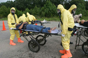 Soldiers assigned to a Chemical, Biological, Radiological, Nuclear Explosive Enhanced Response Force Package search for survivors during a simulated attack at the District of Columbia National Guard Armory, Monday, April 03, 2006. The training was part of a demonstration of National Guard capabilities. (U.S. Army Photo by Staff Sgt. Jon Soucy/ 29th MPAD)