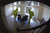 Contaminated house - Staff Sgts. Keith Bryant (left) and Dave Fischer pack up their gear and prepare to exit a simulated contaminated house at Ellsworth Air Force Base, S.D. The Air National Guard's 82nd Civil Support Team based in Rapid City participated in a joint weapons-of-mass-destruction training exercise. (U.S. Air Force photo/Staff Sgt. Michael B. Keller)