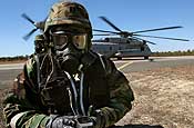 Members of the 21st Weapons of Mass Destruction - Civil Support Team (WMD-CST), New Jersey National Guard, check for radiological contamination during Operation Dependable Response - a combined Guard and Marine exercise held at Warren Grove Air to Ground Range, N.J., on March 3.