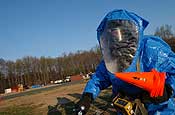  U.S. Army Spc. Michael Townsend, from the North Carolina National Guard, waits for his next radio instruction during an exercise in Charlotte, N.C., March 20, 2007. Townsend is assigned to the 42nd Civil Support Team which is performing a unit-wide prece rtification exercise at the Charlotte Firefighter Academy. (U.S. Air Force photo by Tech. Sgt. Brian E. Christiansen)