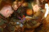 Medical personnel with the CERF-P's medical element provide aid to a simulated patient.