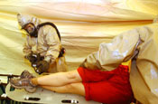  A CERF-P team member checks a simulated victim of a massive explosion with possible hazardous contaminants.