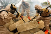 Soldiers assigned to a Chemical, Biological, Radiological, Nuclear Explosive Enhanced Response Force Package search for survivors during a simulated attack at the District of Columbia National Guard Armory, Monday, April 03, 2006. The training was part of a demonstration of National Guard capabilities. (U.S. Army Photo by Staff Sgt. Jon Soucy/ 29th MPAD)