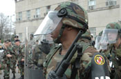 A National Guard Reaction Force member stands ready to deter any rioting protesters during the Vital Guardian Exercise at the District of Columbia National Guard Armory on April 4.