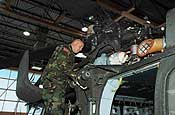 An Oregon Army National Guard Soldier, of Union, Ore., from Detachment 3, Bravo Company, 351 Aviation Maintenance, based out of Pendleton, Ore., performs maintenance on a UH-60 Blackhawk helicopter in Phoenix, Ariz. on Feb. 20. Dotson is serving in Arizona on Operation Jump Start, and the UH-60 Blackhawks are used for various aviation support missions, such as transportation of personnel, and supply of materials. (U.S. Air Force photo by Senior Airman Trish Harris, 142nd Fighter Wing - Visual Information)