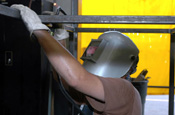 A U.S. Army Soldier of the Texas Army National Guard performs a welding job on a gun cage for the U.S. Border Patrol at the Laredo north station in Laredo, Texas, July 14, 2006. The U.S. National Guard is helping the U.S. Border Patrol secure the U.S. border with Mexico. (U.S. Army photo by Sgt. Jim Greenhill)
