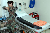 A West Virginia Air National Guard member, not identified for security reasons, helps set up a medical clinic in the abandoned company town of Playas in isolated southwest New Mexico. The clinic will be used to treat personnel participating in Operation Jump Start, the National Guard's support to the Customs and Border Patrol. (Photo by Sgt. Jim Greenhill, National Guard Bureau)