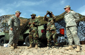 U.S.- Mexican Border, Southwestern Arizona. Brigadier General Matthew Whittington, the Arizona National Guard Operation Jump Start commander, meets with soldiers assigned to the 1-252 Combined Arms Battalion, North Carolina Army National Guard, who are continuously standing by and observing an area of the border. The unit is currently deployed here for thier annuall training observing the border, and are working with U.S. Border Patrol in support of Operation Jump Start. Photo by Tech Sgt Brian E. Christiansen, North Carolina Air National Guard.
