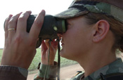 A U.S. Army Sgt., with 252nd Combined Arms Battalion, North Carolina Army National Guard, looks through binoculars near an area of the U.S.-Mexican border in San Luis, Ariz., July 27, 2006. The Soldiers are currently working with the U.S. Border Patrol in support of Operation Jump Start. (U.S. Air Force photo by Tech. Sgt. Brian E. Christiansen) (Released)