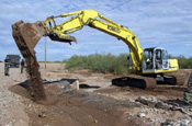 Members of the 166 Airlift Wing, Delaware Air National Guard repair washed out roadway along the United States Border just outside of Douglas, Arizona, as part of the 'Operation Jump Start' Program.