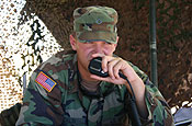 (ALONG THE U.S.-MEXICO BORDER, WEST OF YUMA, Ariz.) (Sept. 12, 2006) A member of the Washington National Guard, contacts a nearby Border Patrol agent by radio. Soldiers and airmen from the Washington National Guard are manning a series of observation posts along the U.S. Mexico border as part of Operation Jump Start. Under the Operation, National Guardsmen and women from around the nation are working with the U.S. Border Patrol to provide an extra set of eyes and ears along the border, reporting potential border crossers or other suspicious activity to Border Patrol agents who make apprehensions and perform any other necessary law enforcement duties. (U.S. Army photo by Pvt. 1st Class Monette Wesolek.)