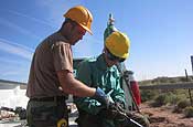National Guard Soldiers from Rapid City prepare to cut a cross section of a permanent vehicle barrier Thursday, Nov. 2, at the 115th Engineer Detachment work site that was south of Columbus, N.M., during the unit's support of Operation Jumpstart. (Photo by Sgt. 1st Class Eric Jennings)