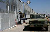 California National Guard engineers are hard at work on the construction of a secondary fence in the San Diego Sector. (U.S. Army photo by Sgt. 1st Class Gordon Hyde)