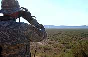  A National Guard entry identification team watches the U.S. border with Mexico near Columbus, N.M., on Nov. 29, 2006. The ridge in the distance is in Mexico. The National Guard is helping the Border Patrol secure the nation's southern border in Operation Jump Start. U.S. Army photo by Sgt. Jim Greenhill